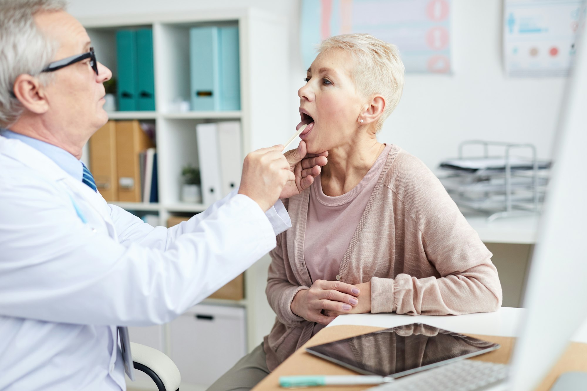 Doctor examining sick patient